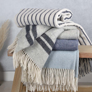 A collection of Australian Pure Wool Throws in shades of blue and grey