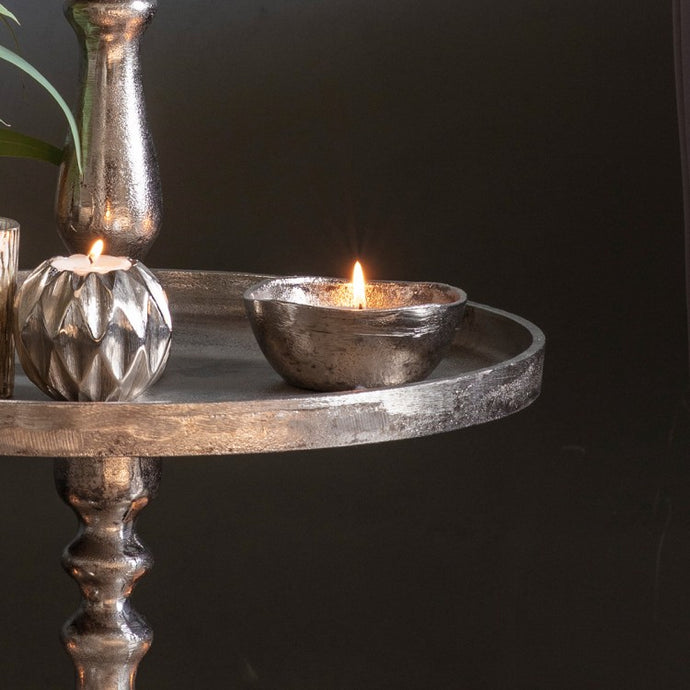 Handmade metal candle holder with a slightly imperfect rim and antique gold finish